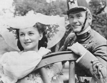 de Havilland and Errol Flynn in THEY DIED WITH THEIR BOOTS ON